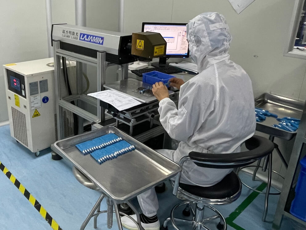Individual testing each product at industrial machine.